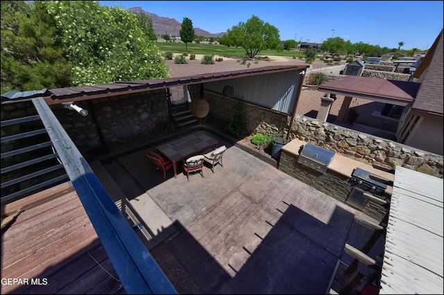 view of patio featuring a mountain view, a grill, and area for grilling