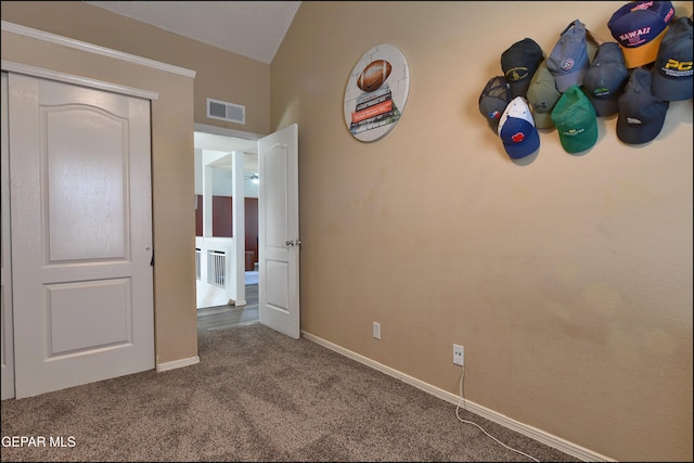 unfurnished bedroom featuring carpet flooring and baseboards
