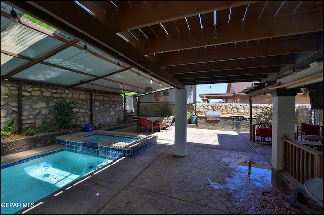 view of pool featuring area for grilling, a patio, and a pool with connected hot tub
