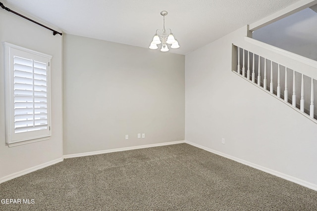 3136 Hawk Point Pl, El Paso, TX 79938 - carpeted empty room with a chandelier and baseboards