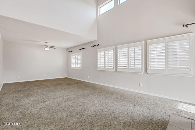 3136 Hawk Point Pl, El Paso, TX 79938 - unfurnished living room with carpet, a ceiling fan, a high ceiling, and baseboards