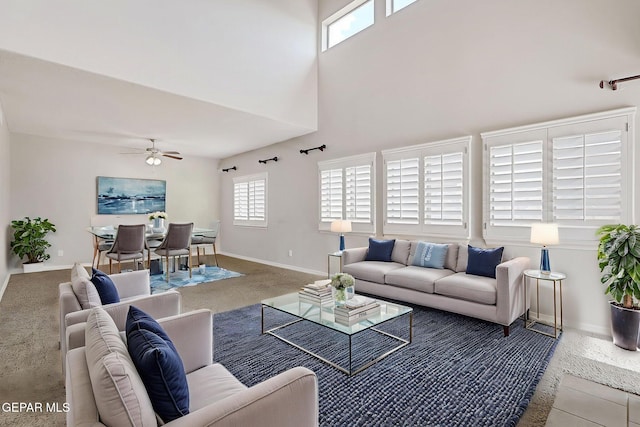 3136 Hawk Point Pl, El Paso, TX 79938 - carpeted living room featuring ceiling fan, baseboards, and a towering ceiling