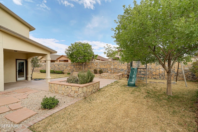 3136 Hawk Point Pl, El Paso, TX 79938 - view of yard featuring a playground and a patio