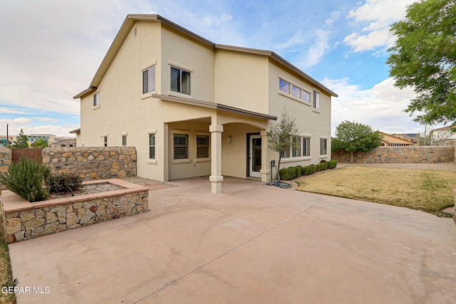 3136 Hawk Point Pl, El Paso, TX 79938 - back of property with a patio area, stucco siding, and fence