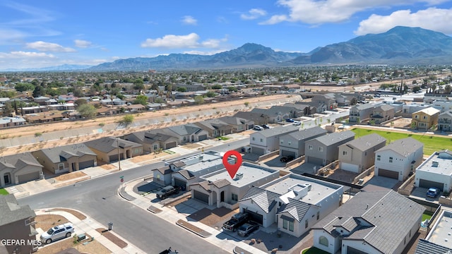 aerial perspective of suburban area featuring a mountainous background