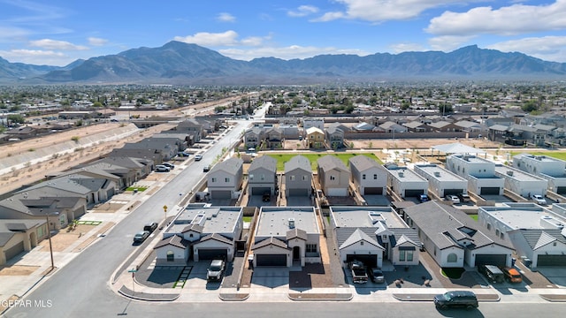 aerial perspective of suburban area with a mountainous background