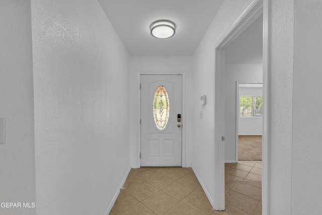 589 Gallagher St, El Paso, TX 79915 - entryway featuring light tile patterned flooring and baseboards