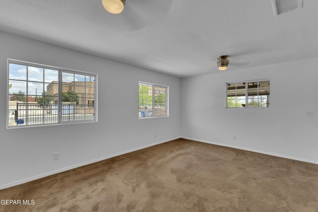 589 Gallagher St, El Paso, TX 79915 - empty room with ceiling fan, carpet, and baseboards