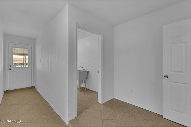 589 Gallagher St, El Paso, TX 79915 - hall featuring light tile patterned floors and baseboards