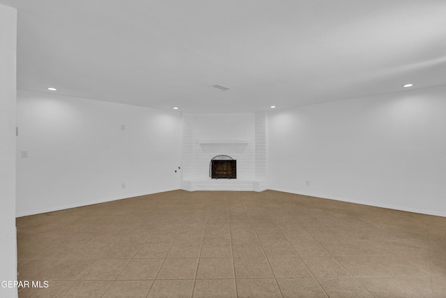 589 Gallagher St, El Paso, TX 79915 - unfurnished living room featuring recessed lighting and a brick fireplace
