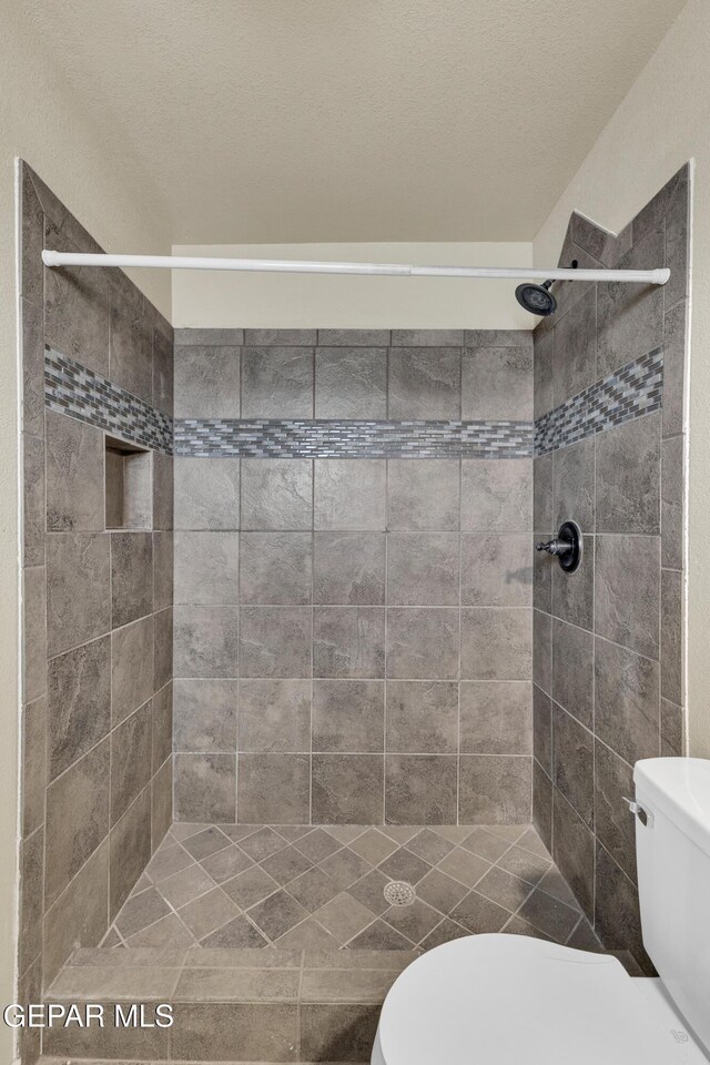589 Gallagher St, El Paso, TX 79915 - bathroom with toilet and a shower stall
