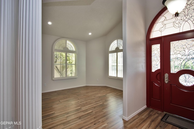 1483 Via Appia St, El Paso, TX 79912 - foyer entrance with wood finished floors, recessed lighting, baseboards, and lofted ceiling