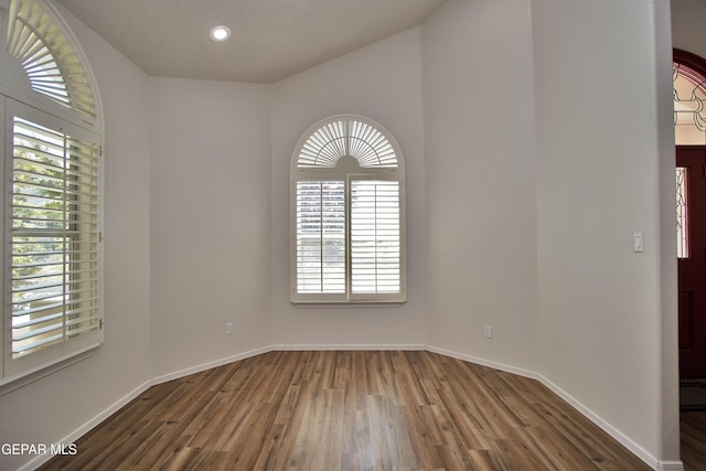 1483 Via Appia St, El Paso, TX 79912 - empty room featuring wood finished floors, baseboards, and recessed lighting