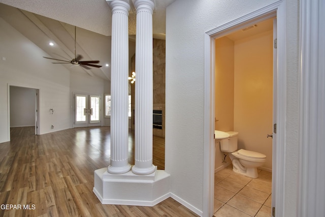 1483 Via Appia St, El Paso, TX 79912 - hallway featuring ornate columns, vaulted ceiling, and wood finished floors