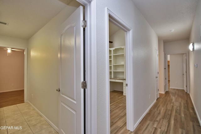 1483 Via Appia St, El Paso, TX 79912 - hall with light wood-type flooring and baseboards