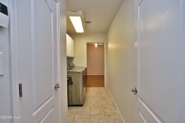 1483 Via Appia St, El Paso, TX 79912 - washroom with separate washer and dryer, cabinet space, light tile patterned floors, baseboards, and a ceiling fan