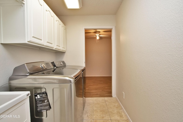 1483 Via Appia St, El Paso, TX 79912 - laundry room with washing machine and dryer, cabinet space, light tile patterned floors, baseboards, and a ceiling fan