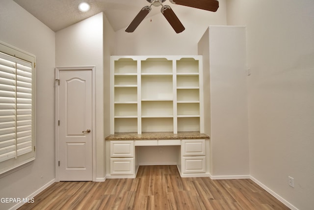 1483 Via Appia St, El Paso, TX 79912 - unfurnished office featuring built in study area, light wood-style floors, baseboards, and a ceiling fan