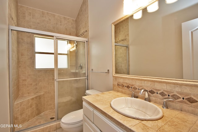 1483 Via Appia St, El Paso, TX 79912 - full bathroom featuring toilet, a stall shower, tasteful backsplash, and vanity