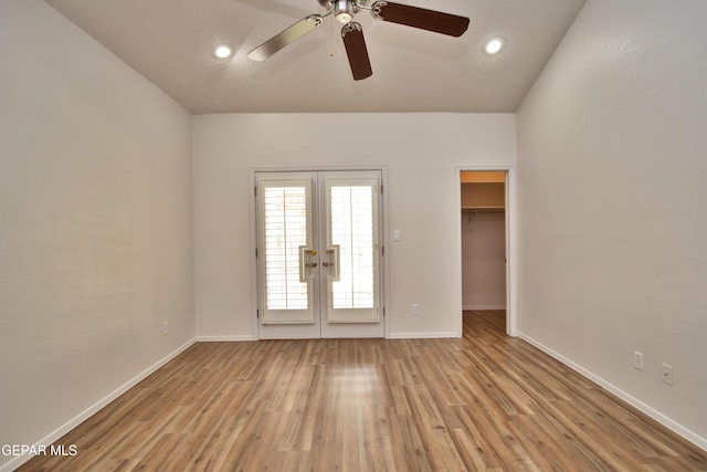 1483 Via Appia St, El Paso, TX 79912 - spare room featuring french doors, light wood-type flooring, a ceiling fan, baseboards, and recessed lighting