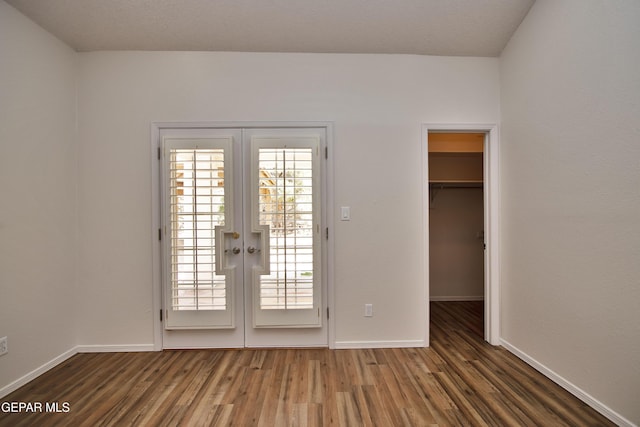 1483 Via Appia St, El Paso, TX 79912 - doorway to outside with french doors, wood finished floors, and baseboards
