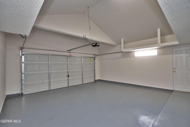 1483 Via Appia St, El Paso, TX 79912 - garage featuring a garage door opener and baseboards