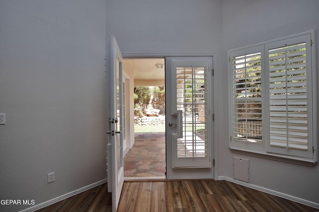 1483 Via Appia St, El Paso, TX 79912 - doorway to outside with wood finished floors and baseboards