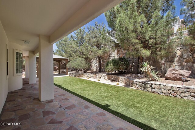 1483 Via Appia St, El Paso, TX 79912 - view of grassy yard with a patio area
