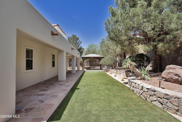 1483 Via Appia St, El Paso, TX 79912 - view of green lawn with a gazebo and a patio