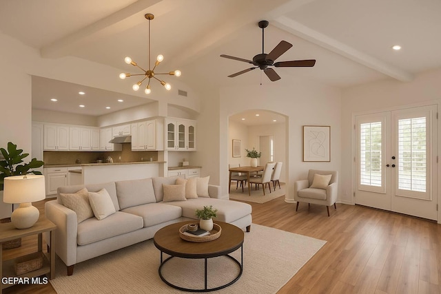 1483 Via Appia St, El Paso, TX 79912 - living area featuring arched walkways, light wood finished floors, ceiling fan, recessed lighting, and a chandelier