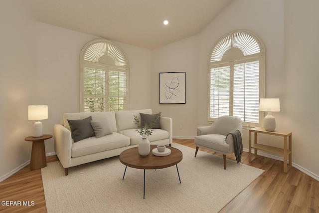 1483 Via Appia St, El Paso, TX 79912 - living area with light wood-style floors, vaulted ceiling, and baseboards