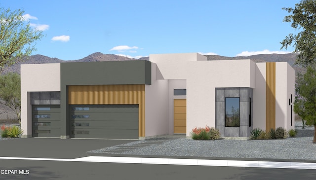 332 Rio Del Rancho Ct, El Paso, TX 79932 - contemporary house featuring a mountain view, stucco siding, an attached garage, and gravel driveway