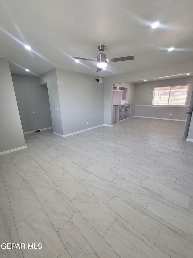 unfurnished room with baseboards, a ceiling fan, and recessed lighting