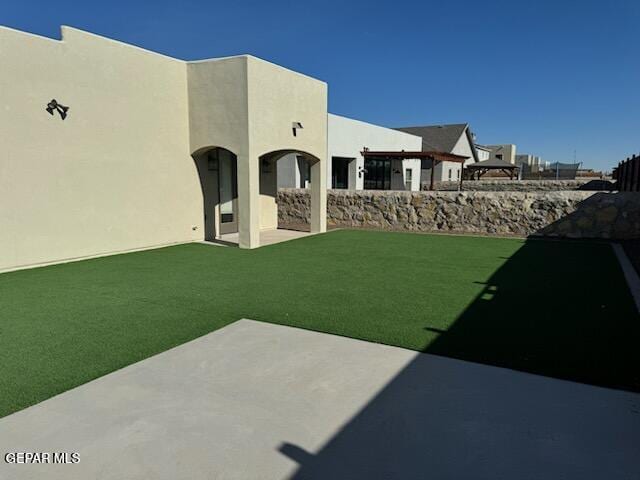 14844 Jack White Ave, El Paso, TX 79938 - view of grassy yard with a patio