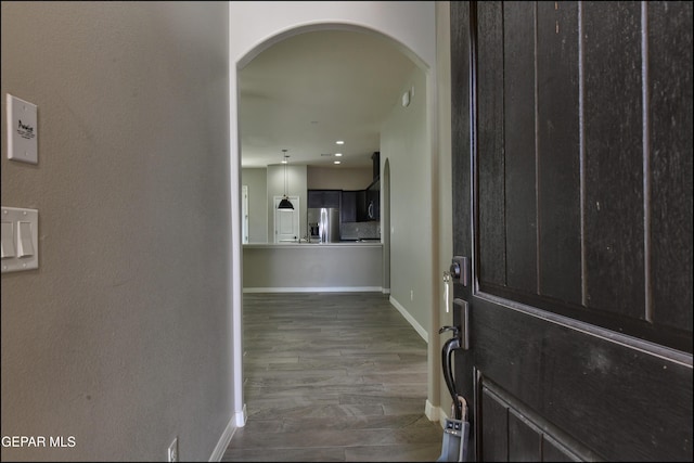 14844 Jack White Ave, El Paso, TX 79938 - foyer featuring arched walkways, baseboards, wood finished floors, and recessed lighting