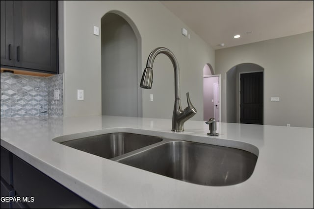 14844 Jack White Ave, El Paso, TX 79938 - kitchen view of a sink, light countertops, backsplash, and recessed lighting