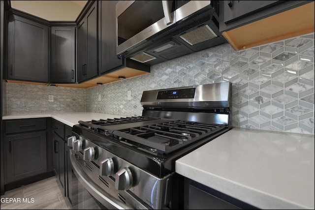 14844 Jack White Ave, El Paso, TX 79938 - kitchen with appliances with stainless steel finishes, light countertops, and tasteful backsplash