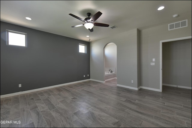 14844 Jack White Ave, El Paso, TX 79938 - spare room featuring a ceiling fan, arched walkways, recessed lighting, and baseboards