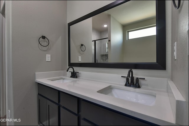 14844 Jack White Ave, El Paso, TX 79938 - bathroom with a stall shower and double vanity