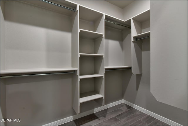 14844 Jack White Ave, El Paso, TX 79938 - spacious closet featuring dark wood finished floors