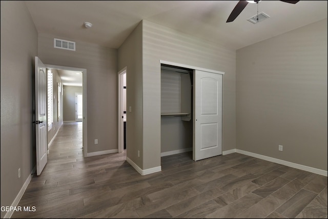 14844 Jack White Ave, El Paso, TX 79938 - unfurnished bedroom featuring a closet, baseboards, dark wood-style flooring, and a ceiling fan