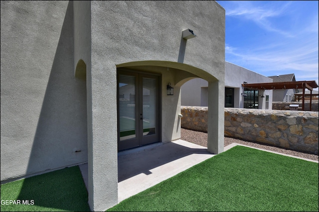 14844 Jack White Ave, El Paso, TX 79938 - entrance to property with stucco siding, french doors, and a patio area