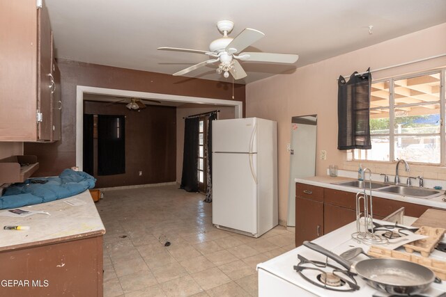 933 Duskin Dr, El Paso, TX 79907 - kitchen featuring freestanding refrigerator, a sink, ceiling fan, and light countertops