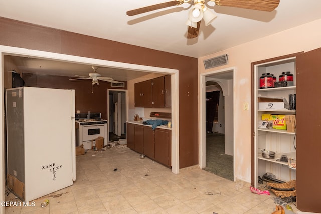 933 Duskin Dr, El Paso, TX 79907 - kitchen featuring white appliances, ceiling fan, and arched walkways