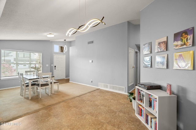 dining space with baseboards and tile patterned floors