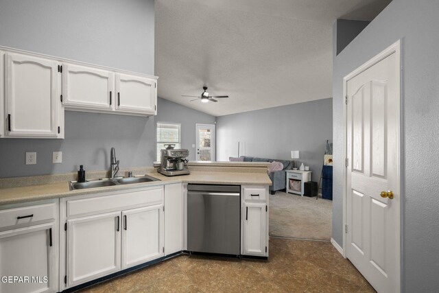 kitchen featuring dishwasher, a sink, a ceiling fan, a peninsula, and white cabinets