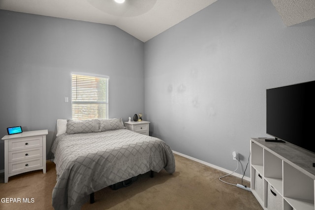 bedroom featuring carpet floors, vaulted ceiling, and baseboards