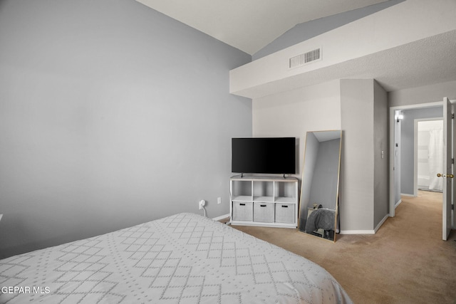 bedroom with carpet, baseboards, and vaulted ceiling