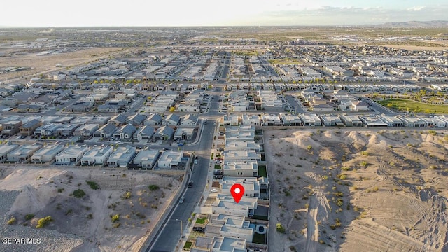 aerial view of property's location featuring nearby suburban area