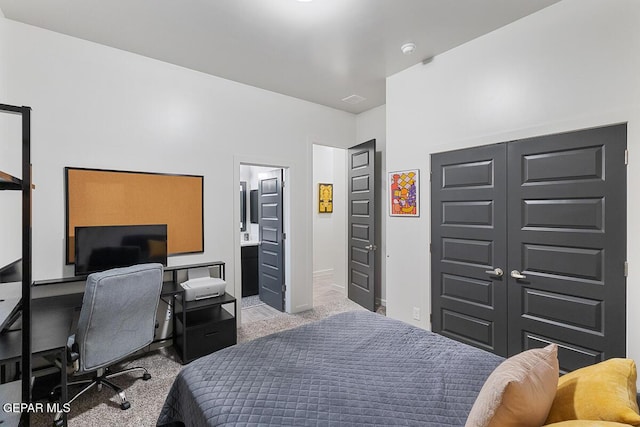 carpeted bedroom with an office area